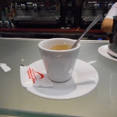 Hollett-Bazouzi, Linda Title: Espresso at McDonald's, the Train Station in La Spezia, Italy