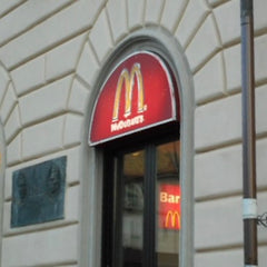 Hollett-Bazouzi, Linda Title: McDonald's at the Train Station, La Speza, Italy