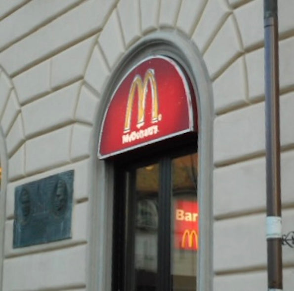 Hollett-Bazouzi, Linda Title: McDonald's at the Train Station, La Speza, Italy