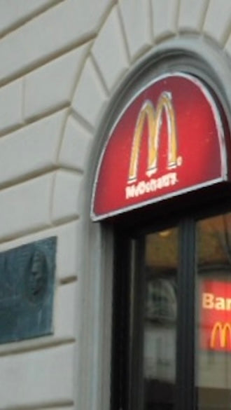 Hollett-Bazouzi, Linda Title: McDonald's at the Train Station, La Speza, Italy